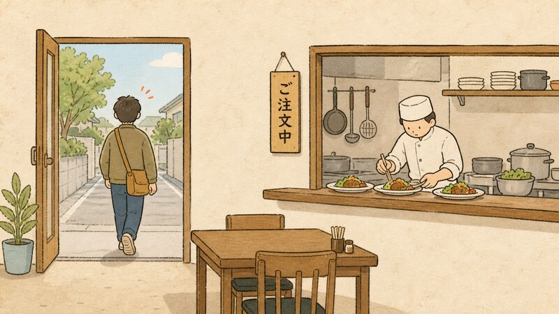 会計を済ませて店を出ていく客の背中と、その奥の厨房で同じ注文の料理をまだ黙々と作り続けている料理人を描いたユーモラスな挿絵。「ご注文中」という札が掲げられている